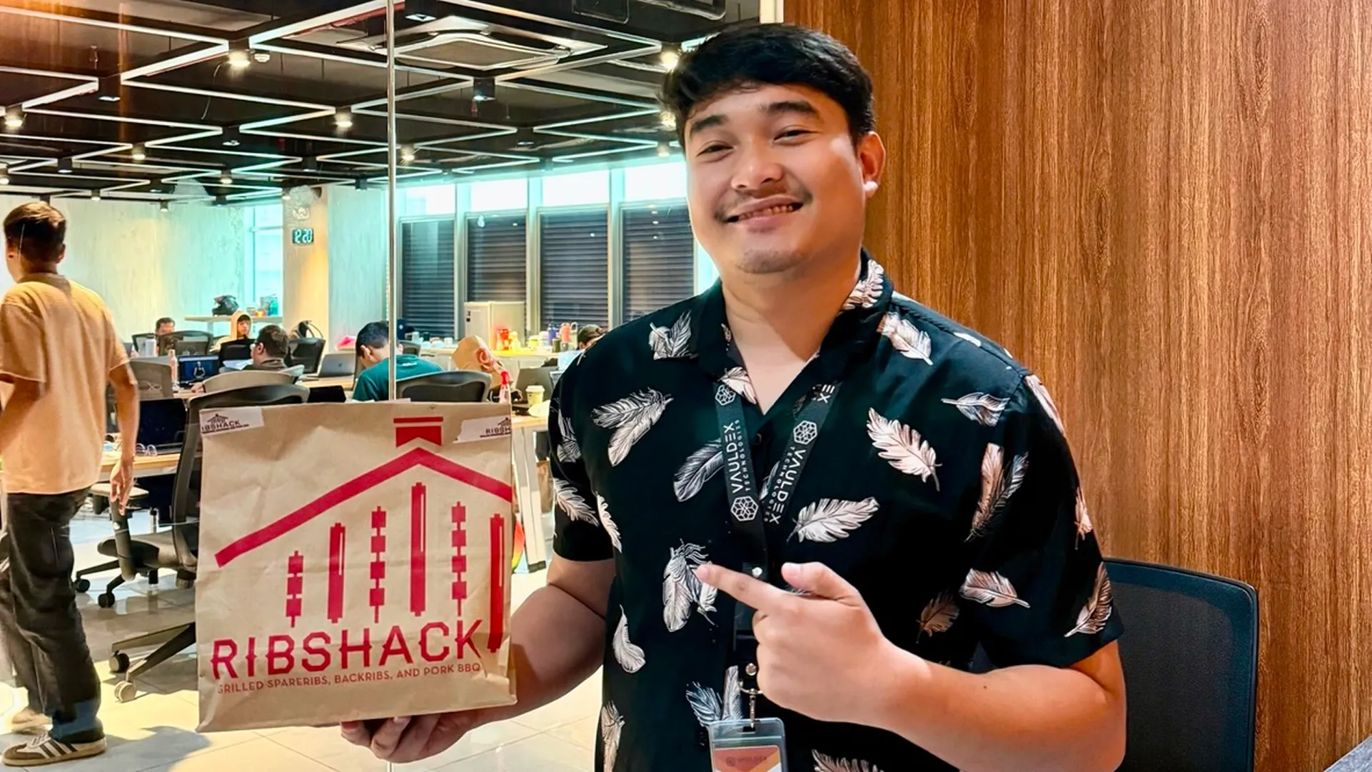 Kem is standing and smiling at us